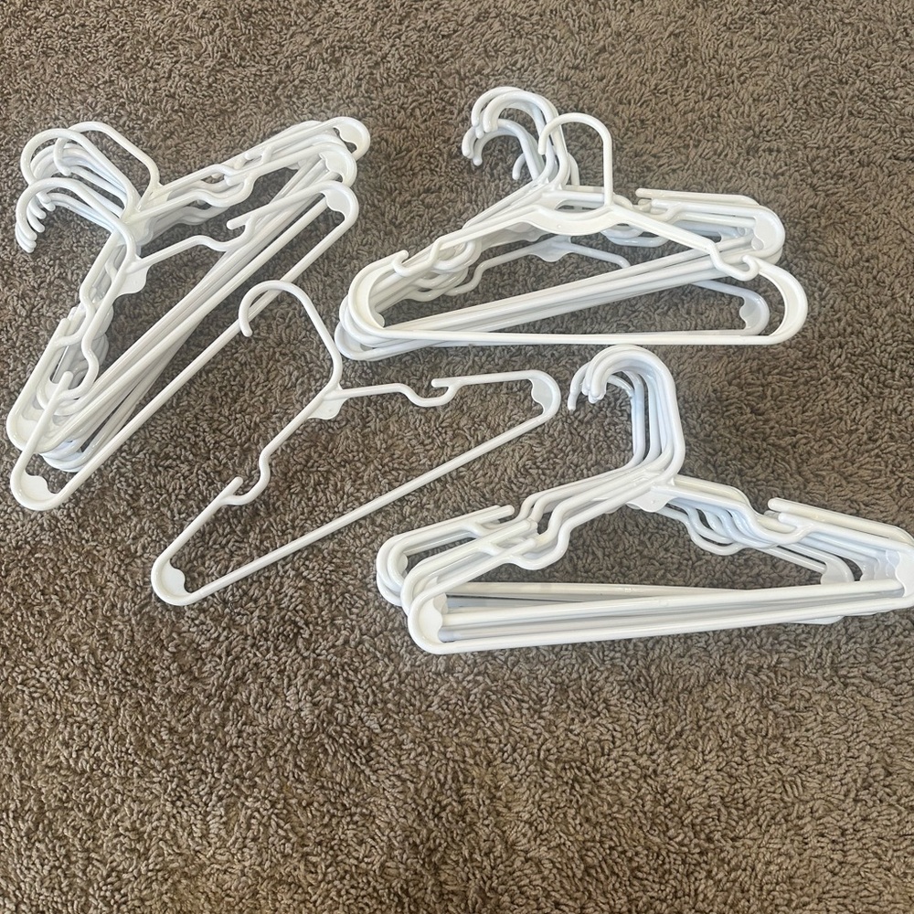 Set of White Plastic Hangers